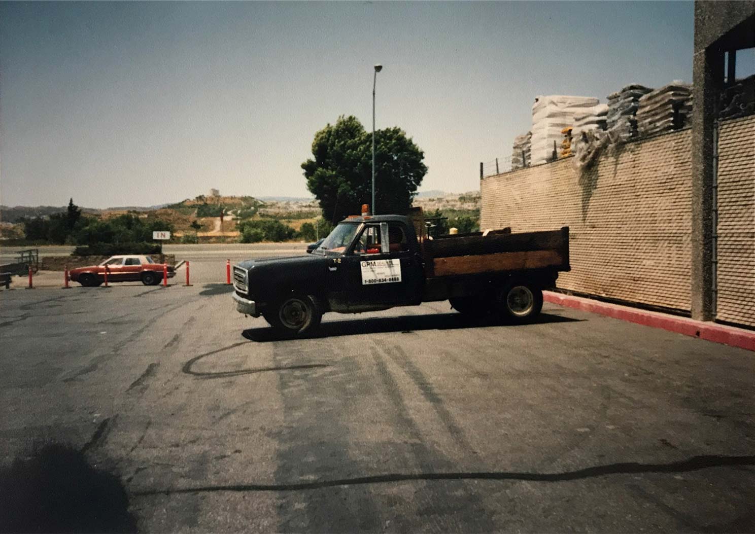Ed Miller’s orange Oldmobile and Gordon’s second company truck in Valencia 1
