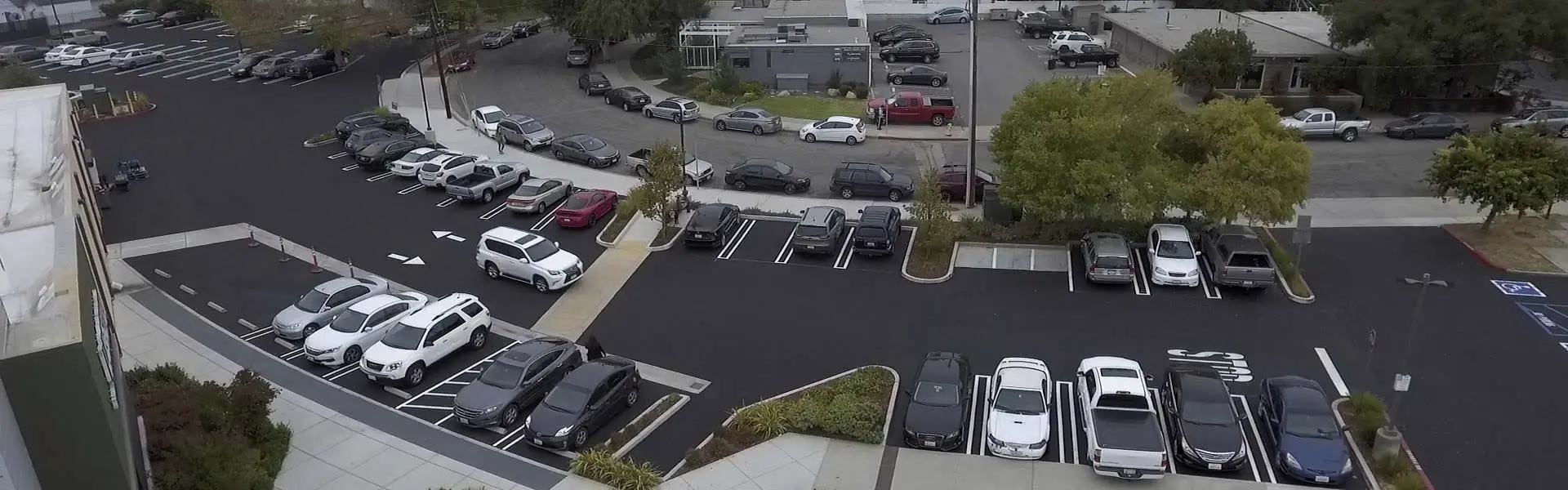 An asphalt parking lot after GPM completed pavement marking and striping.