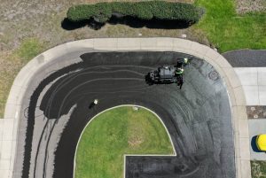 The GPM team laying sealcoat in a buggy for Foothill Estates.